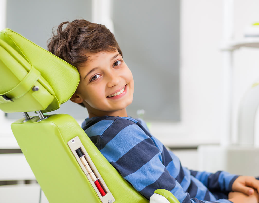 boy sitting in a dental chair