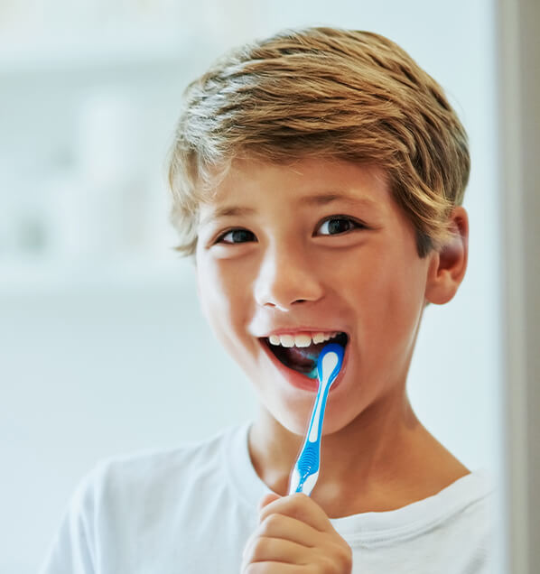 boy brushing his teeth