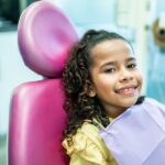 common pediatric dental issues, thumb-sucking, child in dental chair