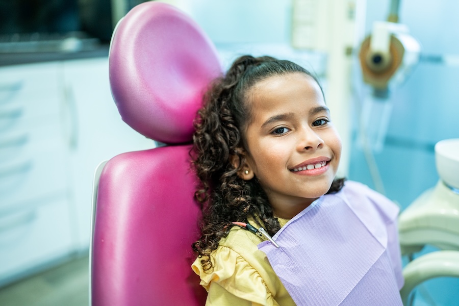 common pediatric dental issues, thumb-sucking, child in dental chair